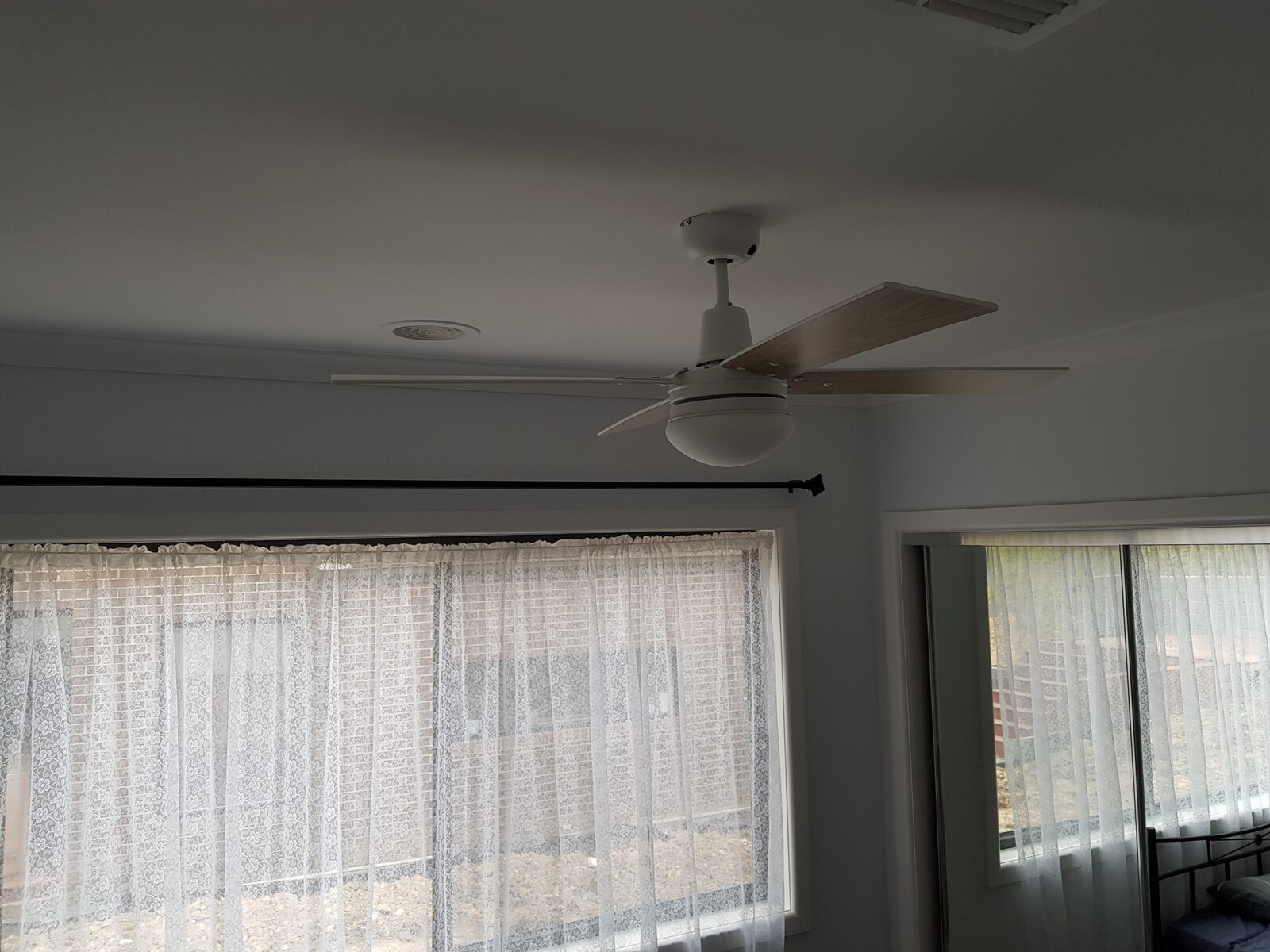 Ceiling fan installed in a bedroom
