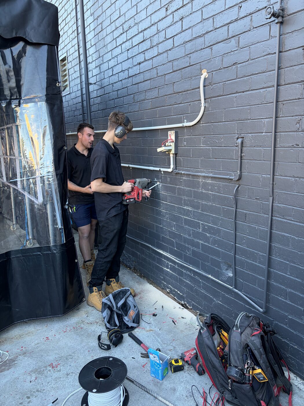 Sandy Electrical team running data cabling on a commercial job