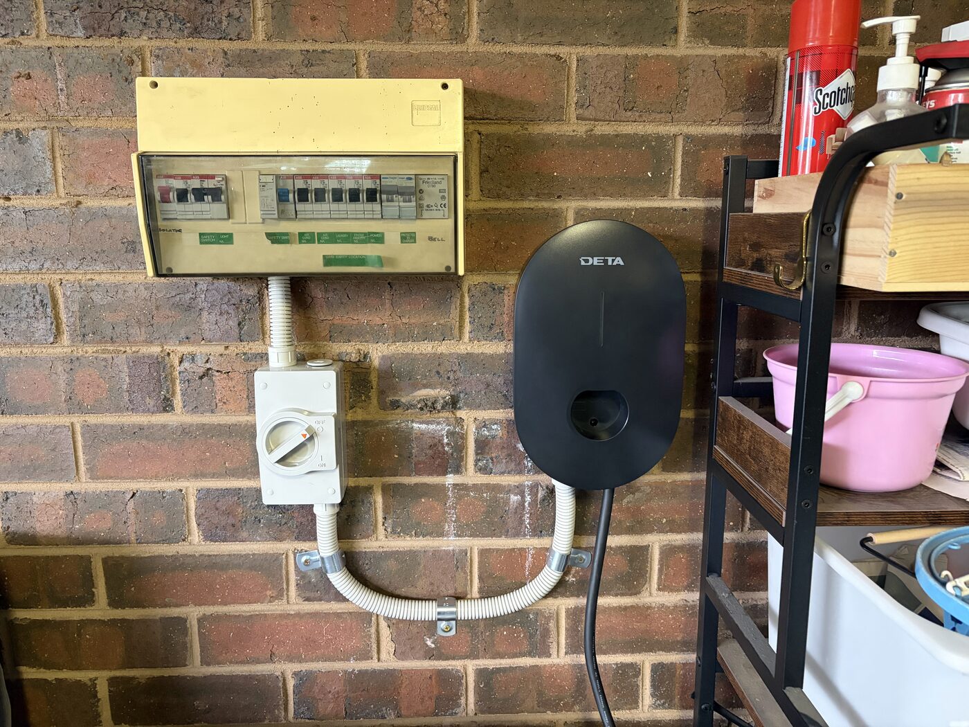 EV charger and dedicated isolator installed in a home garage