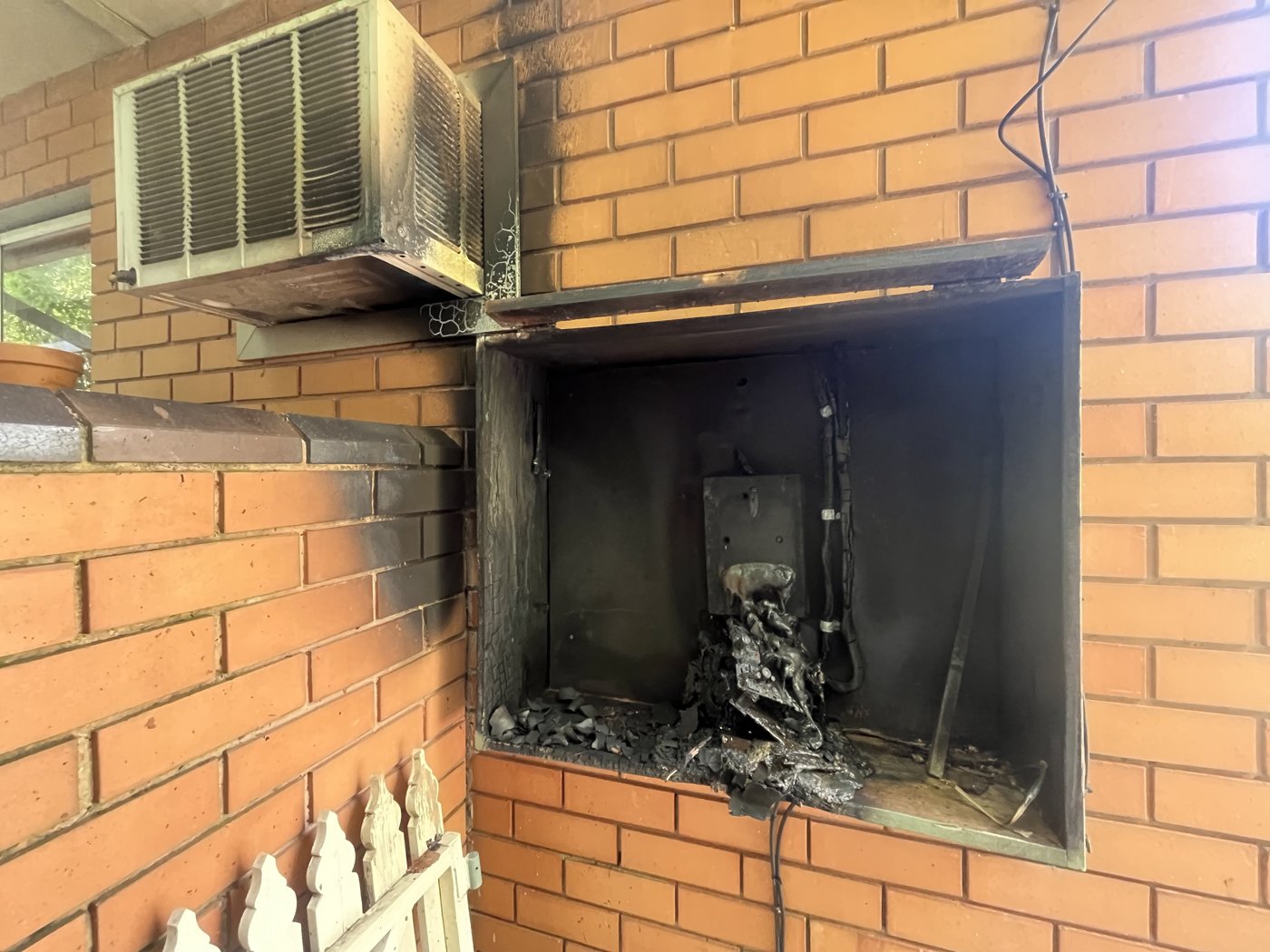Switchboard cavity destroyed by an electrical fire, before repair