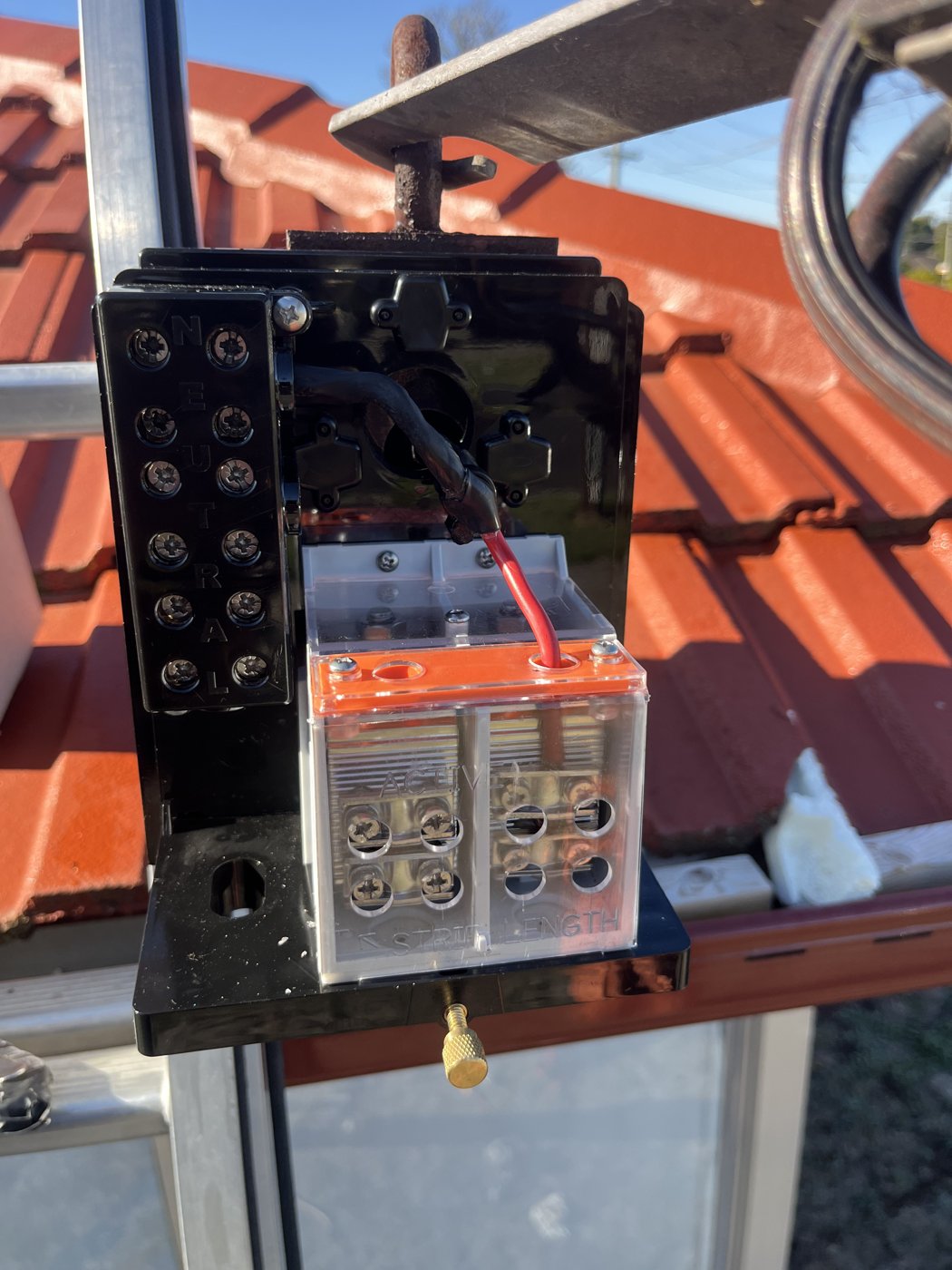 New mains point-of-attachment fuse assembly installed after replacing a burnt-out unit