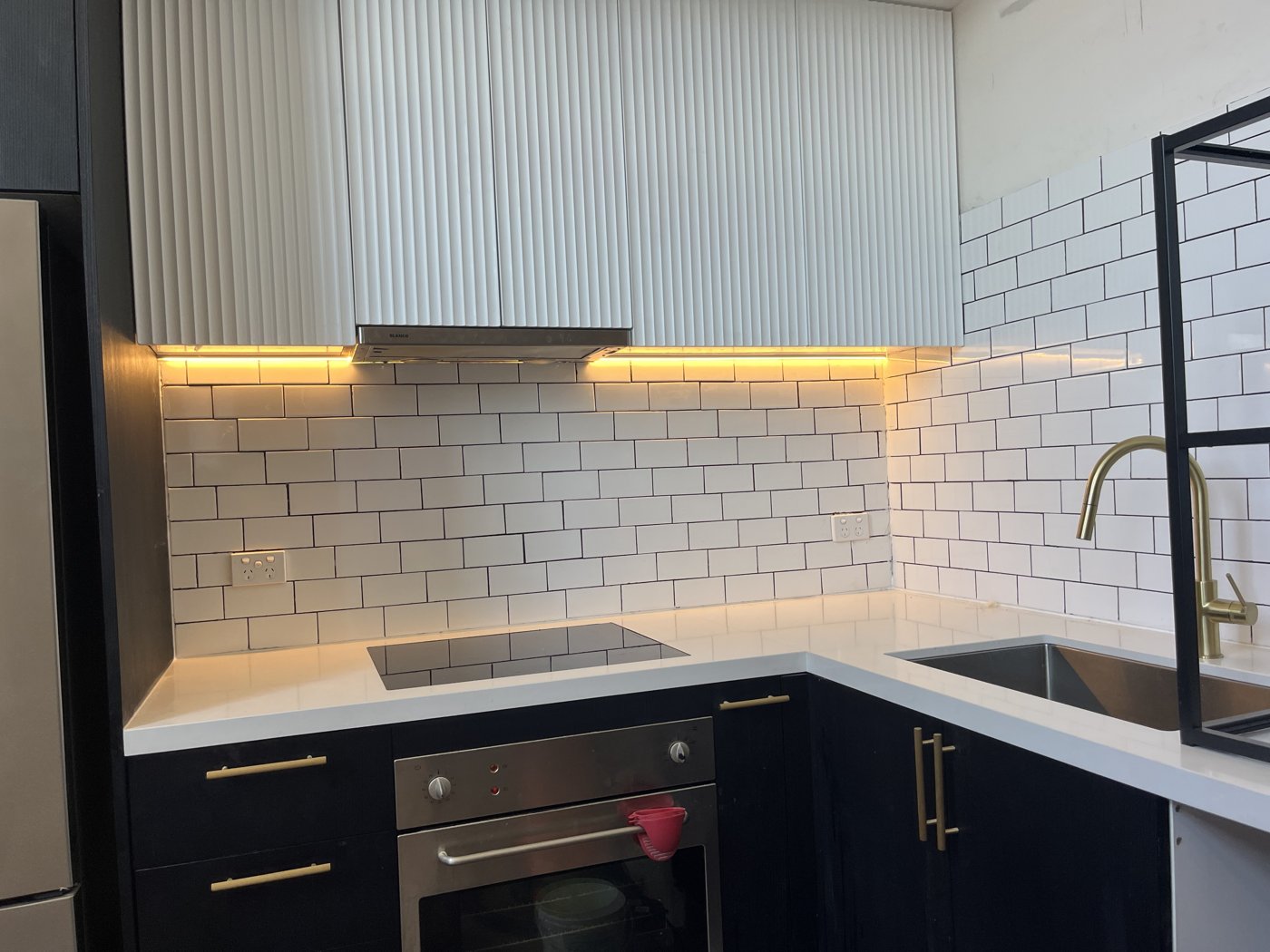 Under-cabinet LED strip lighting installed in a kitchen