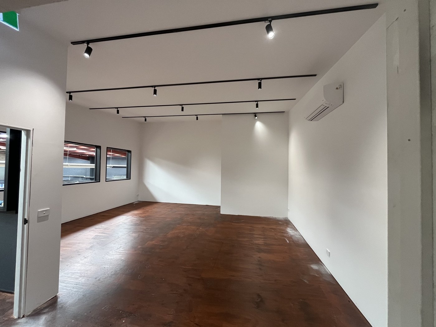 Track lighting installed across a commercial office fit-out ceiling