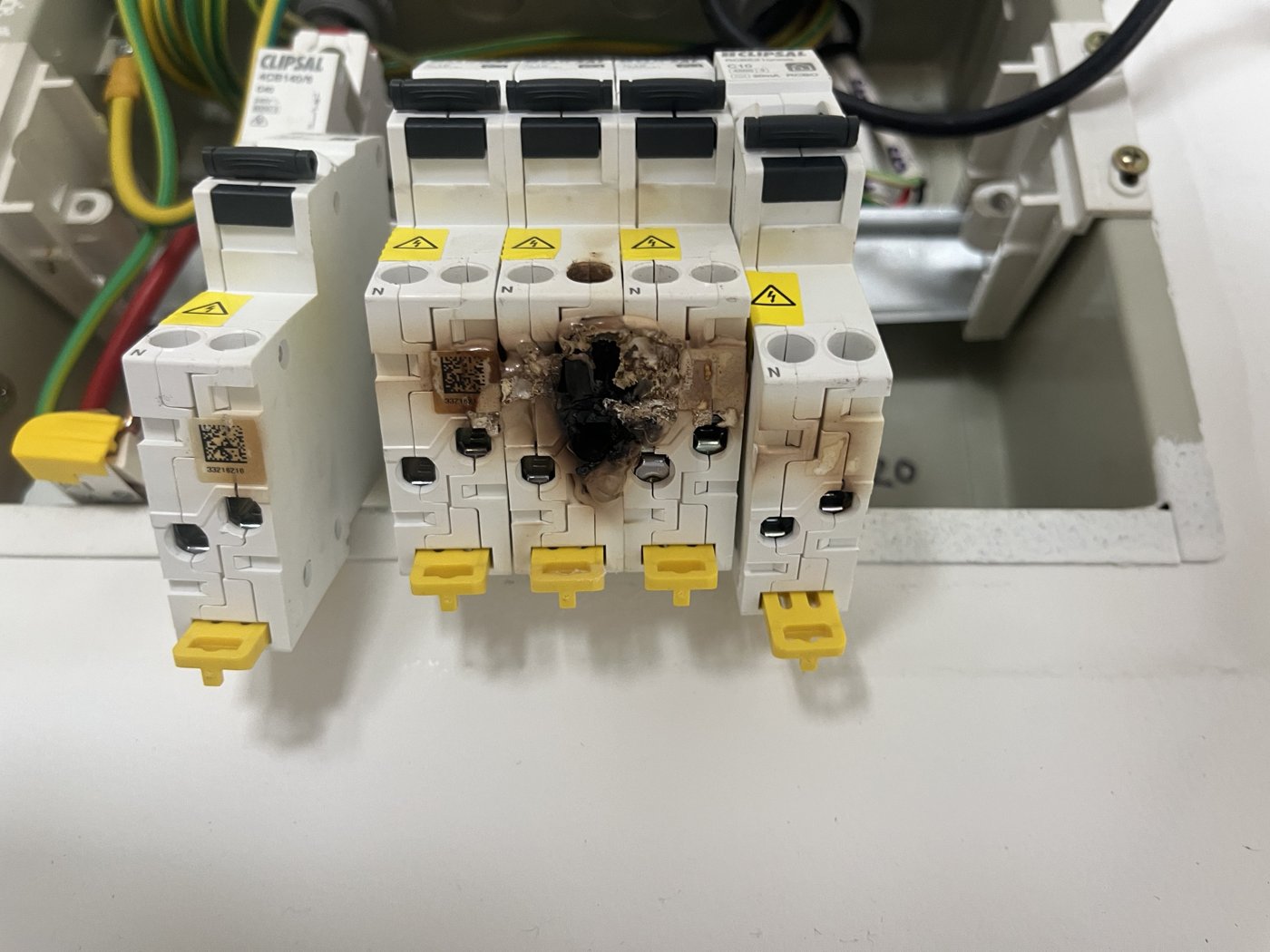 Burnt out circuit breaker on an old switchboard before upgrade