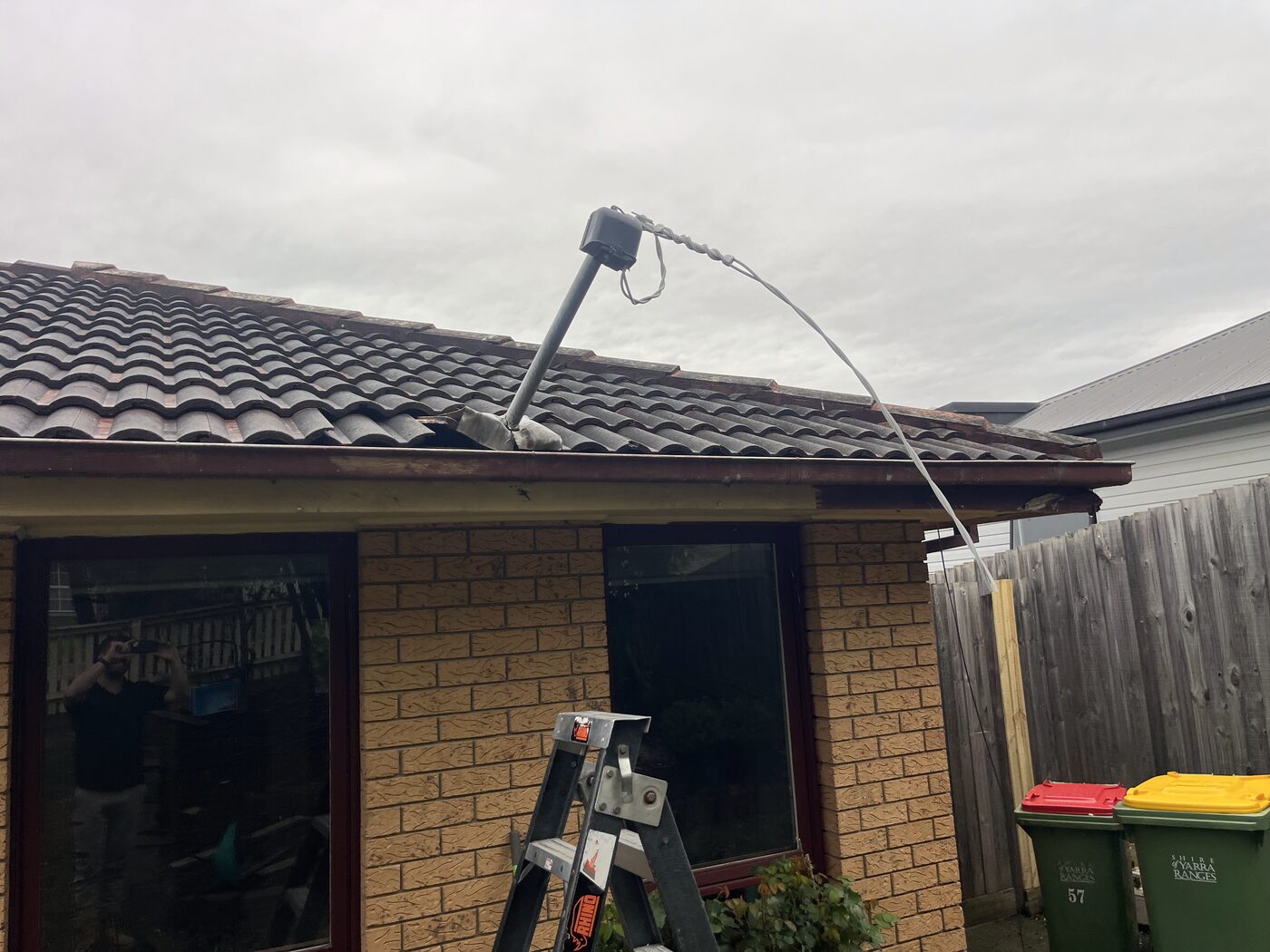 Mains service cable and mast repair on a tiled roof