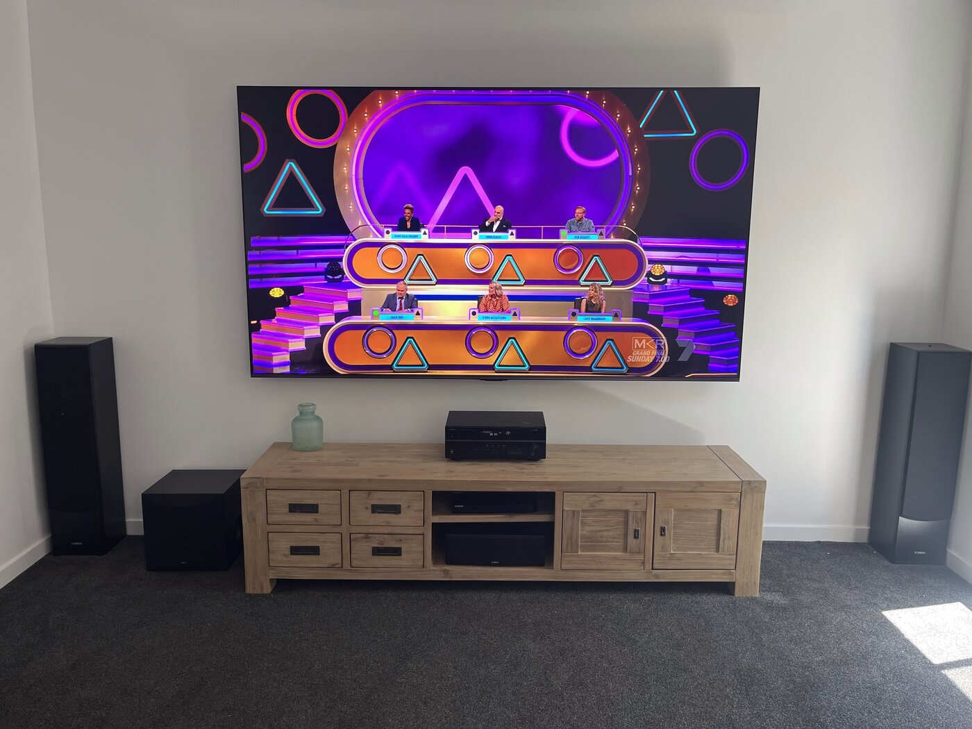 Completed 100 inch TV wall mount with fully concealed cabling and home theatre setup